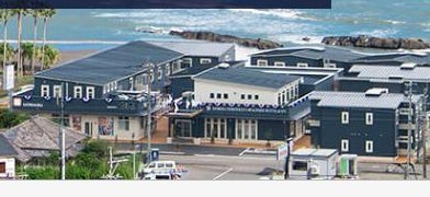 Aoshima Fisherman's Beachside Hotel & Spa, a modern facility ideal for surfers, located near a scenic beach.